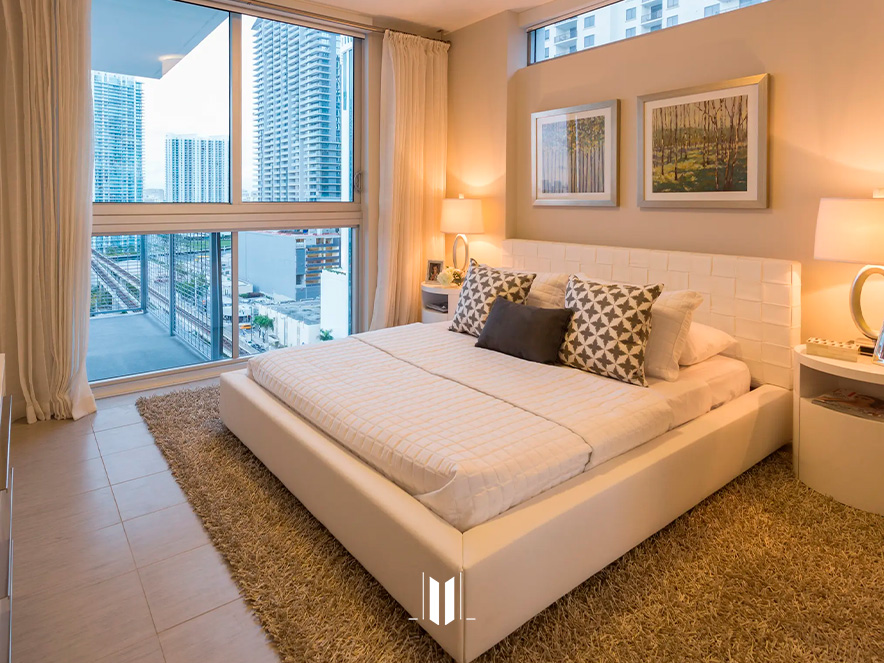Bedroom with double bed and city view window at Brickell View Terrace