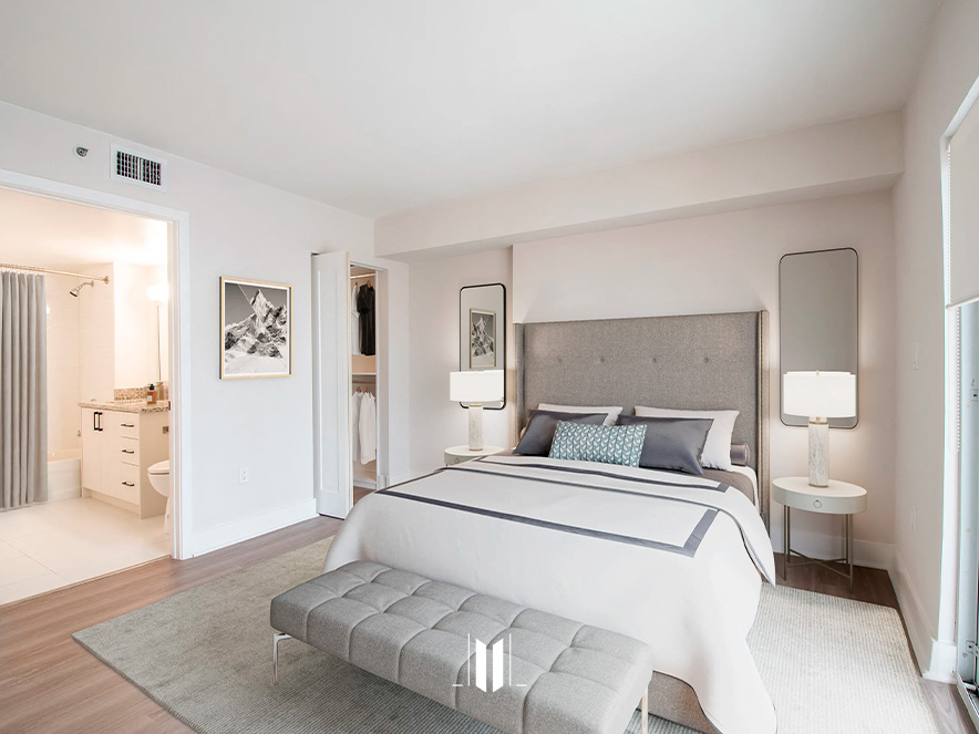 Bright bedroom with double bed and modern decor at Legacy at Brickell